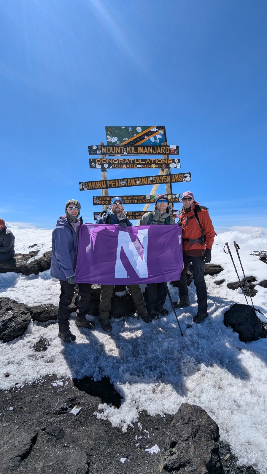 Smiling guests at the Kilimanjaro summit